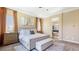 Inviting main bedroom with luxurious bedding, neutral decor, and adjacent bathroom at 6917 E Ingram Cir, Mesa, AZ 85207