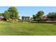Green park with a soccer net and plenty of trees for shade at 6917 E Ingram Cir, Mesa, AZ 85207