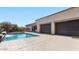Backyard pool with water feature, covered patio, and retractable shades at 6917 E Ingram Cir, Mesa, AZ 85207