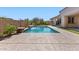 Inviting pool featuring a water feature, with lush landscaping creating a private backyard oasis at 6917 E Ingram Cir, Mesa, AZ 85207