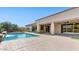 Resort-style pool with baja step, rock accents, and covered patio at 6917 E Ingram Cir, Mesa, AZ 85207