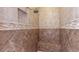 Spacious walk-in shower showcases neutral tile, mosaic trim, built-in bench, and sleek fixtures at 6917 E Ingram Cir, Mesa, AZ 85207