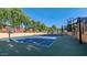 Community tennis and basketball court features professional surfaces and equipment at 6917 E Ingram Cir, Mesa, AZ 85207