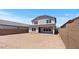 The backyard is spacious and awaiting customization with landscaping and outdoor features at 7327 S 76Th Ln, Laveen, AZ 85339