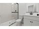 Modern bathroom with a glass-enclosed shower and sleek white vanity at 7327 S 76Th Ln, Laveen, AZ 85339