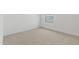 Clean bedroom with neutral carpet and a single window at 7327 S 76Th Ln, Laveen, AZ 85339