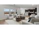 Bright living room showcases hardwood floors and a smooth transition to the kitchen area at 7327 S 76Th Ln, Laveen, AZ 85339