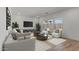 Comfortable living room with neutral decor, plush seating arrangements, and large windows for natural light at 7327 S 76Th Ln, Laveen, AZ 85339