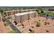 Aerial view of buildings, lush landscaping, and convenient parking in a well-maintained community at 7920 E Camelback Rd # 104, Scottsdale, AZ 85251