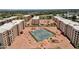 Aerial view showcasing the tennis courts within this well-maintained residential community at 7920 E Camelback Rd # 104, Scottsdale, AZ 85251