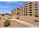 Low angle of residential building with balconies and desert landscaping at 7920 E Camelback Rd # 104, Scottsdale, AZ 85251