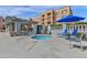 Enjoy the hot tub and grilling area for outdoor entertaining and relaxation at 7920 E Camelback Rd # 104, Scottsdale, AZ 85251