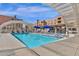 Inviting pool with clear blue water, lounge chairs, and a covered shelter for enjoying the day at 7920 E Camelback Rd # 104, Scottsdale, AZ 85251