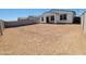 Spacious backyard with block wall fencing, ready for customization and landscaping at 8576 W Yorktown Ct, Florence, AZ 85132