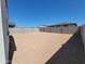 Awaiting a personal touch, the backyard features block wall fencing at 8576 W Yorktown Ct, Florence, AZ 85132