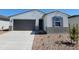 Charming single-story home featuring a two-car garage and a low-maintenance front yard at 8576 W Yorktown Ct, Florence, AZ 85132