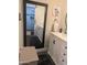 Bathroom with a walk-in shower, vanity, and barn door at 8879 E Friess Dr, Scottsdale, AZ 85260