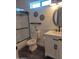 Well-lit bathroom featuring a shower/tub combo, toilet, and a white vanity at 8879 E Friess Dr, Scottsdale, AZ 85260