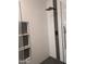Modern walk-in shower features rainfall showerhead, sleek tile, and built-in shelving at 8879 E Friess Dr, Scottsdale, AZ 85260