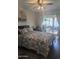 Bedroom with a sliding door to a patio, showcasing a well-lit interior and comfortable living space at 8879 E Friess Dr, Scottsdale, AZ 85260
