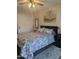 Comfortable bedroom with a queen-sized bed, patterned bedding, and neutral walls with dark trim at 8879 E Friess Dr, Scottsdale, AZ 85260
