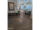 Open kitchen and dining area featuring modern appliances, white cabinetry, and stylish decor at 8879 E Friess Dr, Scottsdale, AZ 85260