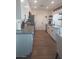 Beautiful kitchen boasting modern white cabinets, quartz countertops, stainless appliances, and stylish finishes at 8879 E Friess Dr, Scottsdale, AZ 85260
