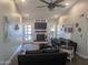 Comfortable living room featuring a fireplace, ceiling fan, and stylish decor, ideal for relaxing and entertaining at 8879 E Friess Dr, Scottsdale, AZ 85260