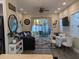 Inviting living room with a cozy sofa, dining area, and sliding glass doors leading to the patio at 8879 E Friess Dr, Scottsdale, AZ 85260