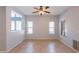 Bonus room featuring tile floors, multiple windows, and a ceiling fan, offering a comfortable space at 931 S Racine Ln, Gilbert, AZ 85296