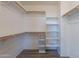 This walk-in closet features a variety of shelving options at 931 S Racine Ln, Gilbert, AZ 85296