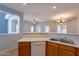 Kitchen view highlights ample counter space, double sinks, and an open design connecting to the living areas at 931 S Racine Ln, Gilbert, AZ 85296