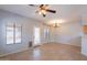 Bright living room featuring tile floors, a back door, and a chandelier, offering a comfortable space at 931 S Racine Ln, Gilbert, AZ 85296