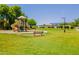 Scenic view of a playground surrounded by greenery and community amenities at 931 S Racine Ln, Gilbert, AZ 85296