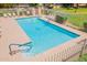 This pool offers a relaxing retreat with its crystal-clear water, sun deck, and a fenced area for privacy and safety at 931 S Racine Ln, Gilbert, AZ 85296