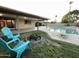 Inviting backyard with a fire pit, swimming pool, covered patio, and lounge chairs at 9615 N 34Th Ave, Phoenix, AZ 85051