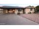 Charming front exterior with a well-maintained yard and a long driveway at 9615 N 34Th Ave, Phoenix, AZ 85051