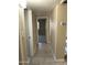 Neutral-toned hallway with tile flooring that leads to multiple rooms at 9615 N 34Th Ave, Phoenix, AZ 85051