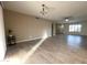 View of living room showing neutral paint, tile floors, and access to other areas of the home at 9615 N 34Th Ave, Phoenix, AZ 85051