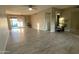 Open-concept living space with tile floors and access to the backyard, perfect for indoor-outdoor living at 9615 N 34Th Ave, Phoenix, AZ 85051
