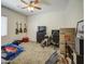 Spacious bedroom with a ceiling fan, three guitars, and a closet with plenty of space at 9759 E Brown Rd, Mesa, AZ 85207
