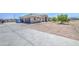 Spacious home with large driveway, three-car garage, and well-manicured front yard at 9759 E Brown Rd, Mesa, AZ 85207
