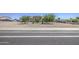Inviting single-story home with desert landscaping and a convenient sidewalk at 9759 E Brown Rd, Mesa, AZ 85207