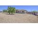 Well-maintained home with desert landscaping, mature trees, and a welcoming facade at 9759 E Brown Rd, Mesa, AZ 85207