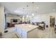 Open-concept kitchen flowing into the living area with an island and stainless appliances at 9759 E Brown Rd, Mesa, AZ 85207