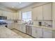 Modern kitchen design with granite countertops, stainless steel appliances, and tile backsplash at 9759 E Brown Rd, Mesa, AZ 85207