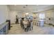 Bright kitchen featuring stainless steel appliances, a large island, and casual dining area at 9759 E Brown Rd, Mesa, AZ 85207