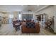 Open-concept living room with ample seating, modern furnishings, and abundant natural light at 9759 E Brown Rd, Mesa, AZ 85207