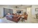 Comfortable living area with stylish furniture, a ceiling fan, and a bright, inviting atmosphere at 9759 E Brown Rd, Mesa, AZ 85207
