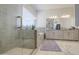 Light-filled main bathroom featuring a glass shower, tub, dual sinks, and elegant finishes for a luxurious experience at 9759 E Brown Rd, Mesa, AZ 85207